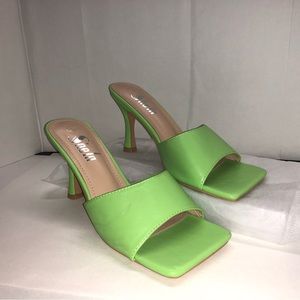 Green faux leather open-toe high stiletto heels.